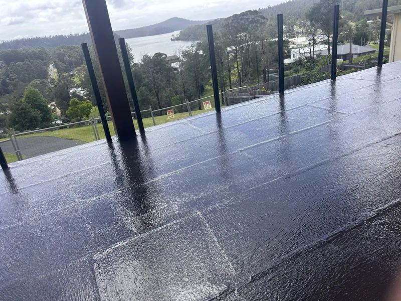 Charcoal membrane balcony with a hilltop view over Jervis Bay water