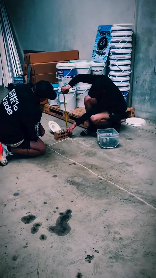 SCW team members crouched on a slab during a training day